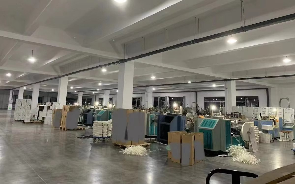 Paper cup forming line producing food-grade printed paper cups at the Conler Papers factory in Anqing, Anhui, China